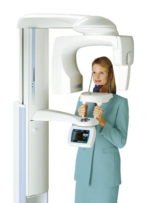 A woman using a CT scanner